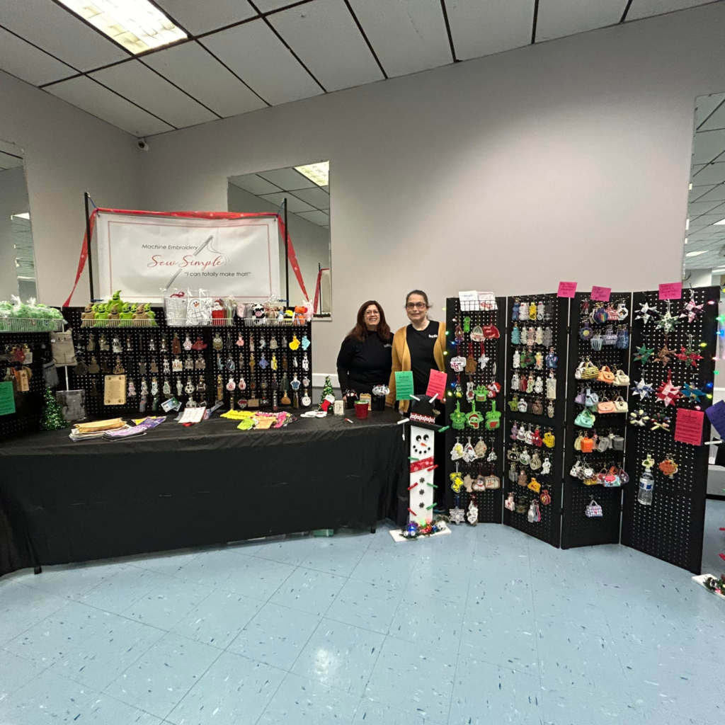 Detailed view of craft show table arrangement highlighting Donna Stawicki